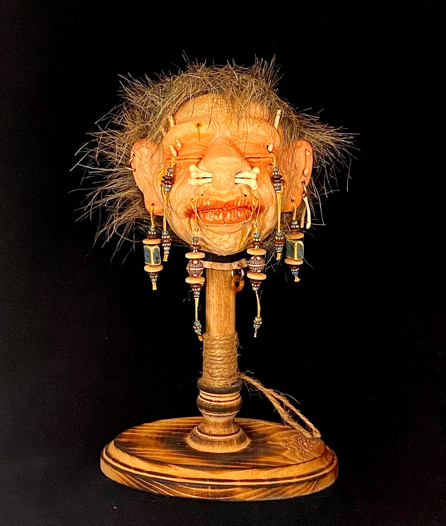 Double Bone Nose Shrunken Head on Stand