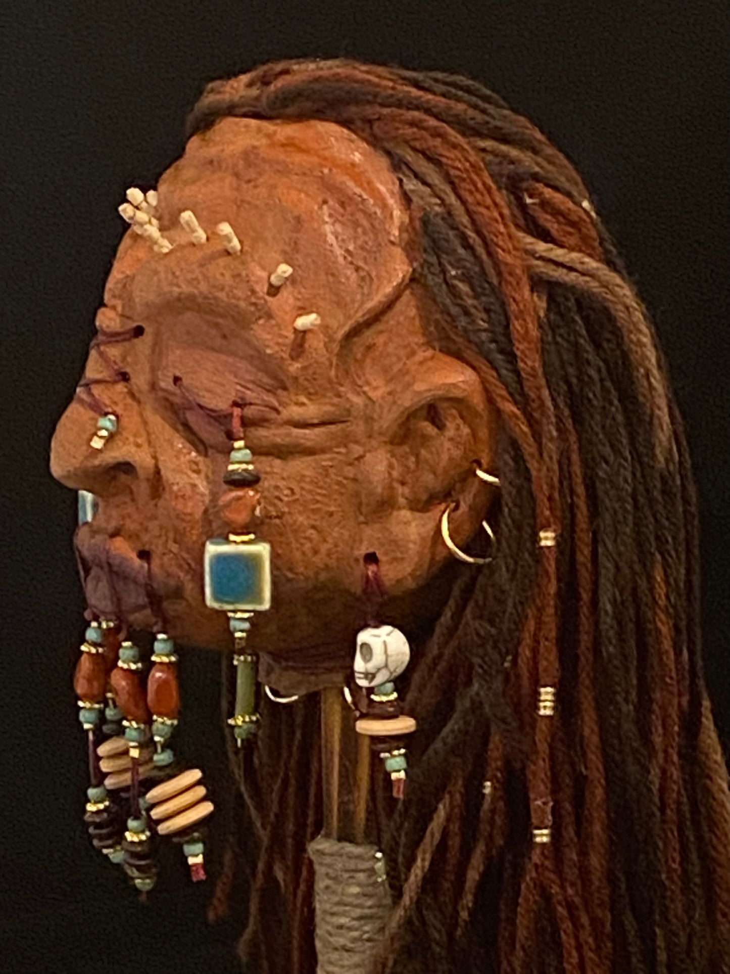 Shrunken Head Blue/Rust beading