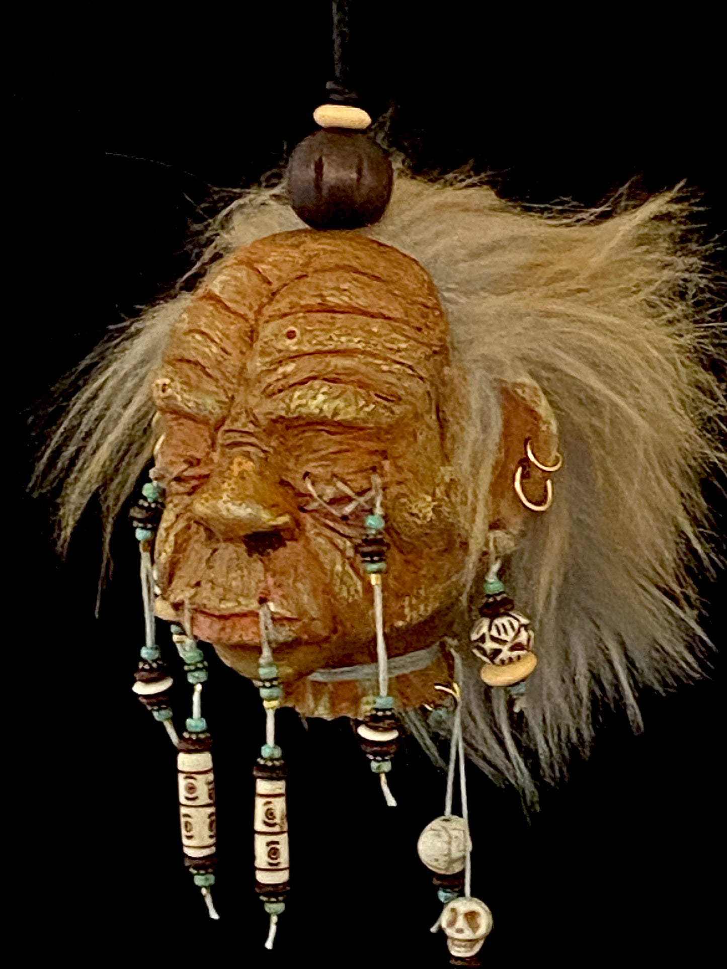 Medium Shrunken Head with Blue green and white beads