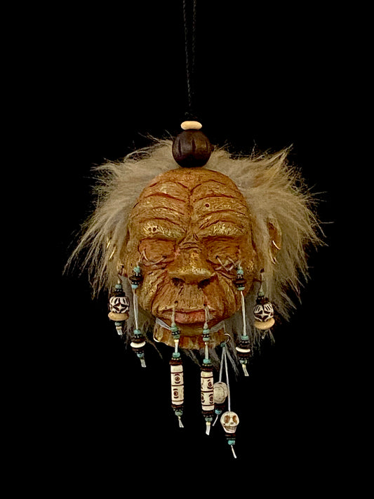 Medium Shrunken Head with Blue green and white beads