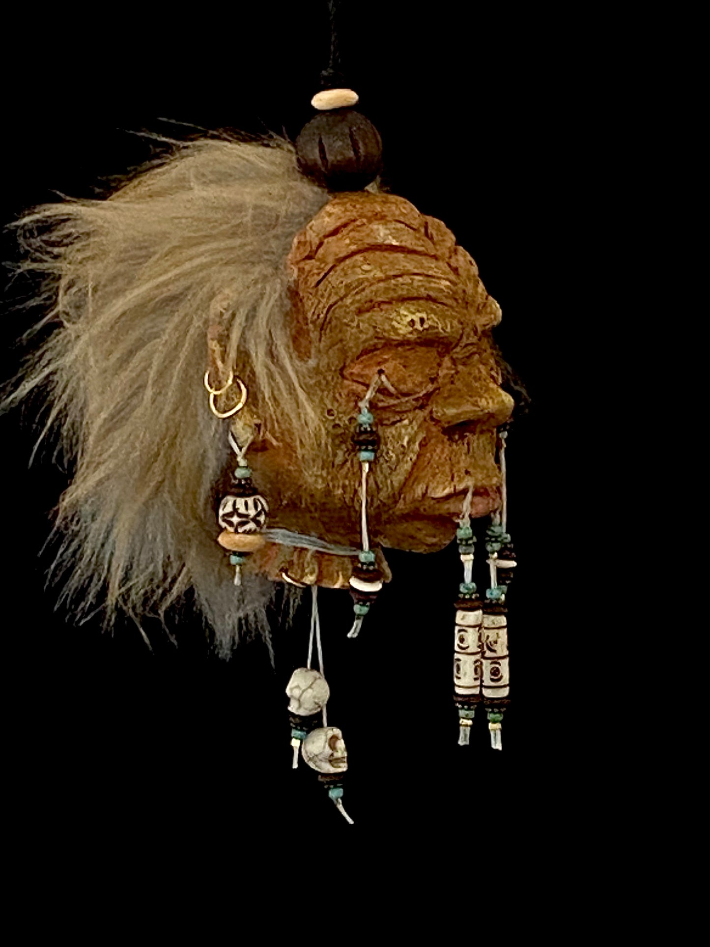 Medium Shrunken Head with Blue green and white beads