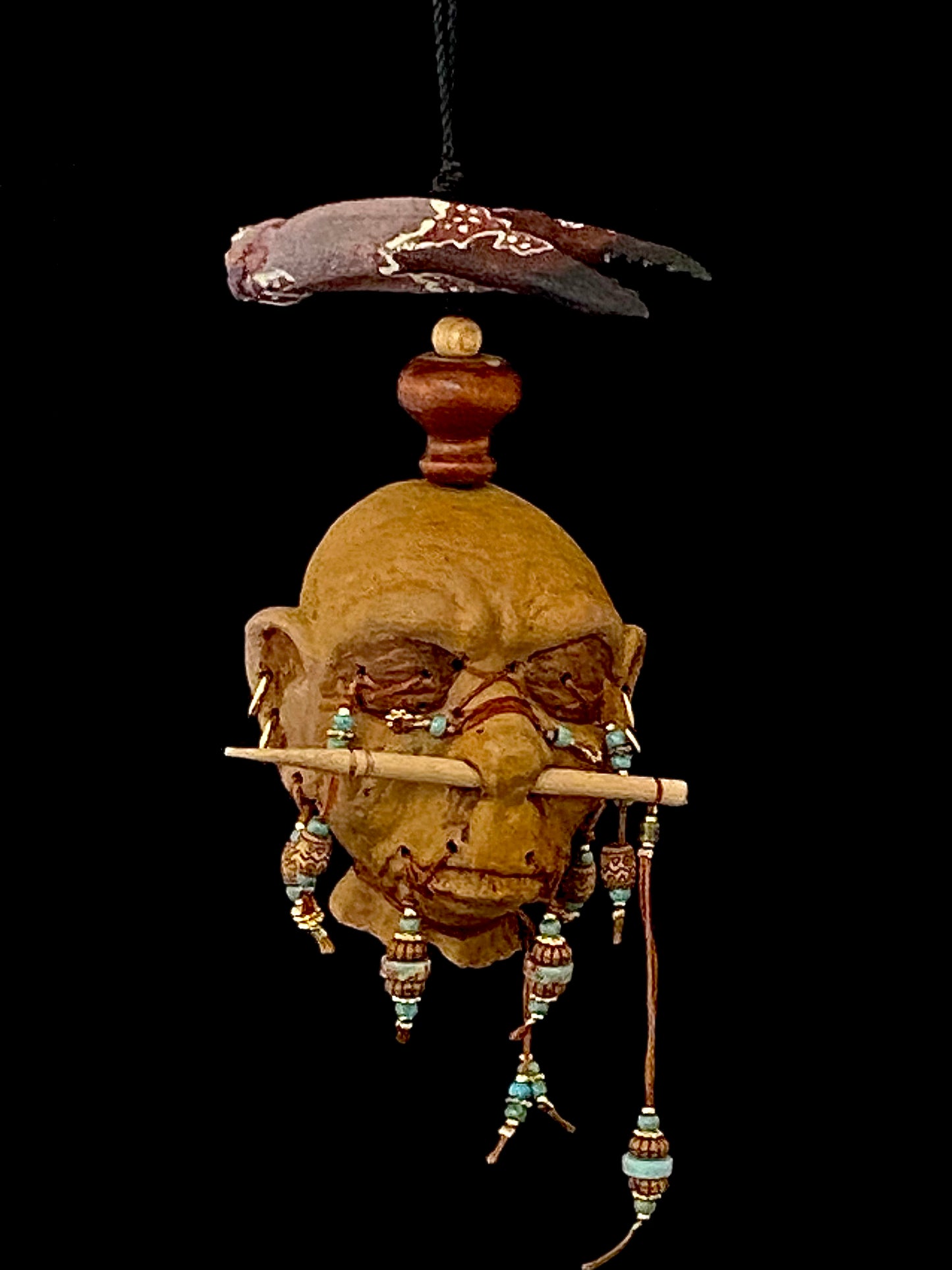 Small Hanging Shrunken Head with Lobster Claw